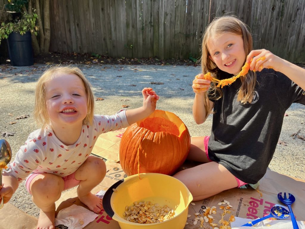 Carving a pumpkin earlier this year