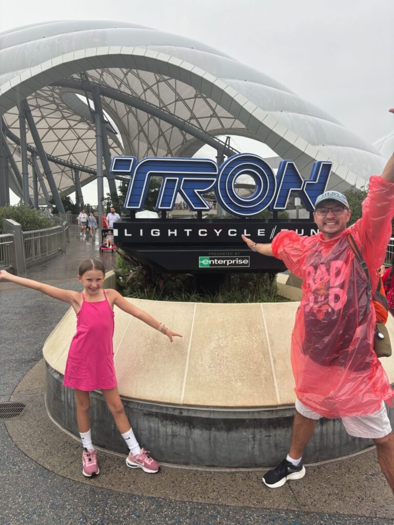 In front of Tron Sign