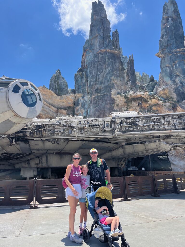 The family in front of the Millennium Falcon